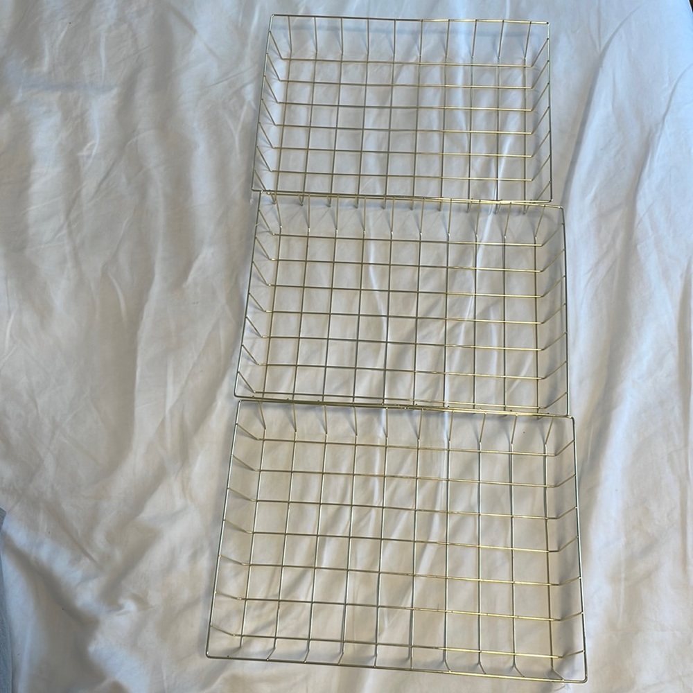 Three gold tone decorative trays. Sold as set.